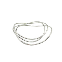 Sterling silver stacked Sway bangles by Knuckle Kiss